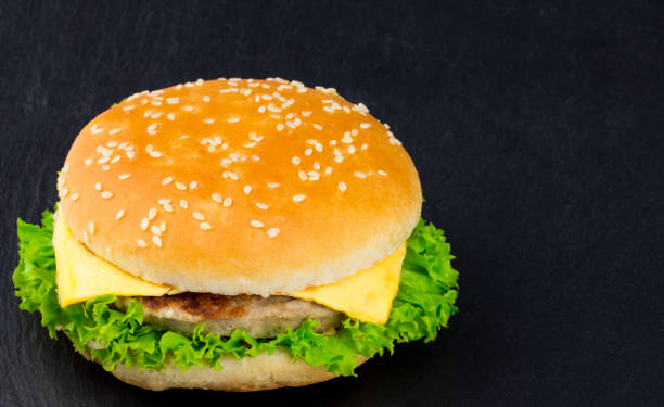 istock fresh tasty burger on black textured background 929115330