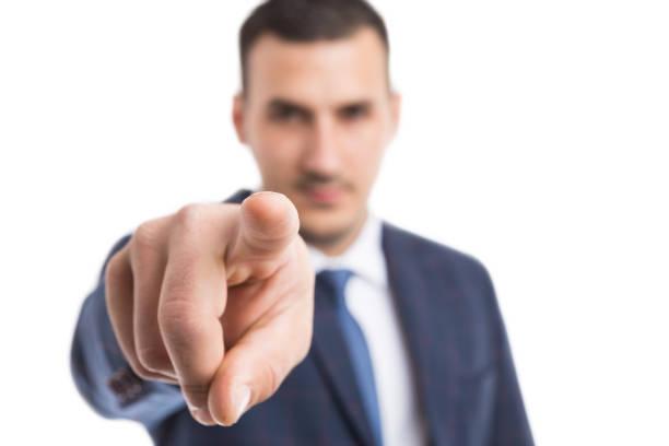 istock Focus on businessman index finger pointing at camera 929123614