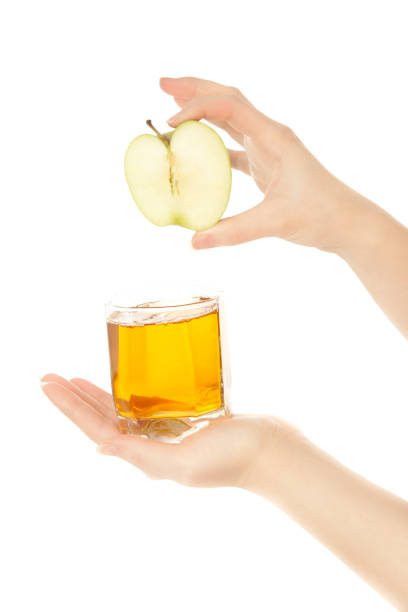 Woman's hands with green apple stock photo