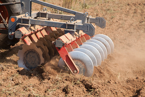 Close up of a disc harrow system, cultivate the soil