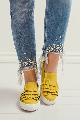spring summer fashion denim and yellow shoes foot and legs