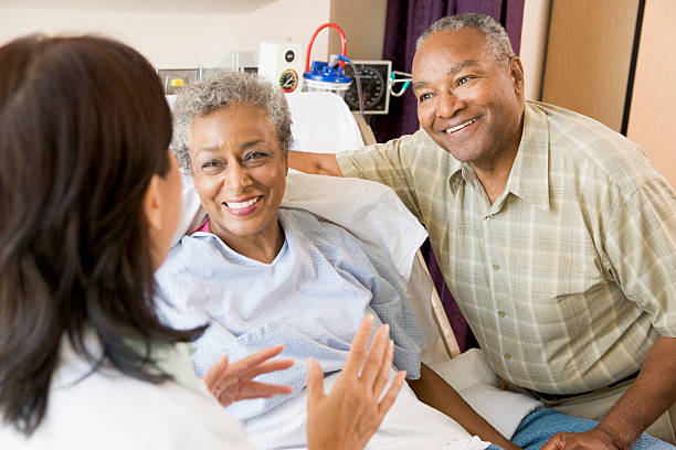 istock Nurse Talking To Senior Couple 92914998