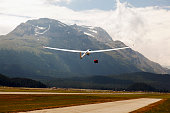 A view of a flying glider in the airport of St Moritz in the alps switzerland