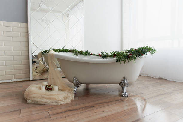 istock Bath on lion's paws, decorated with flowers. On the floor are candles.A romantic setting for a date 929151304