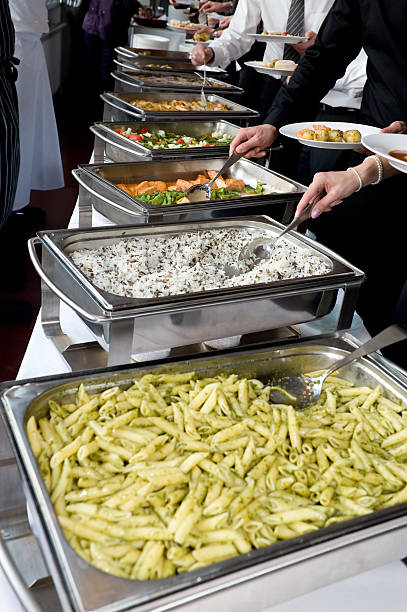Wedding guest's get their meals at the buffet, banquet meals served on tablesPlease see some similar pictures from my portfolio:[url=file_closeup.php?id=10374879&refnum=cruphoto][img]file_thumbview_approve.php?size=1&id=10374879[/img][/url]  [url=file_closeup.php?id=13598829&refnum=cruphoto][img]file_thumbview_approve.php?size=1&id=13598829[/img][/url] [url=file_closeup.php?id=14478727&refnum=cruphoto][img]file_thumbview_approve.php?size=1&id=14478727[/img][/url][url=file_closeup.php?id=14527374&refnum=cruphoto][img]file_thumbview_approve.php?size=1&id=14527374[/img][/url] [url=file_closeup.php?id=15022576&refnum=cruphoto][img]file_thumbview_approve.php?size=1&id=15022576[/img][/url][url=file_closeup.php?id=25806488&refnum=cruphoto][img]file_thumbview_approve.php?size=1&id=25806488[/img][/url]