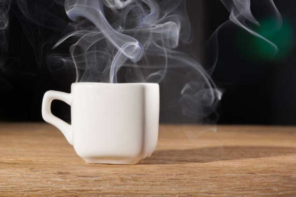 istock steam cup of hot coffee on an oak table 929155596