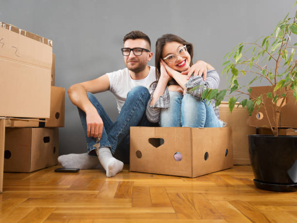 istock Young couple unpacking together and having fun 929155788