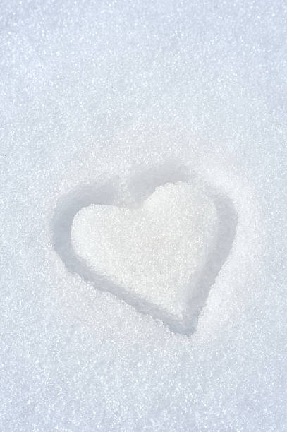 Heart on the snow stock photo