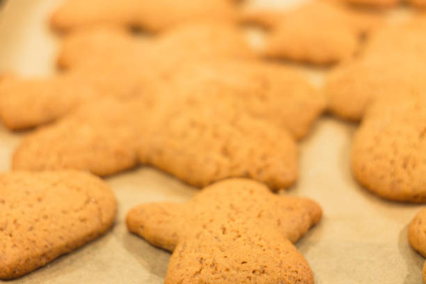 istock Ginger biscuits lie on a baking sheet. Cookies on baking paper 929161614