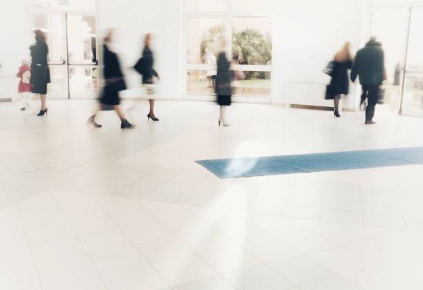 istock abstract crowd of anonymous blurred people walking in a shopping mall 929162574