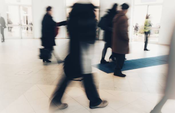 istock abstract crowd of anonymous blurred people walking in a shopping mall 929162578