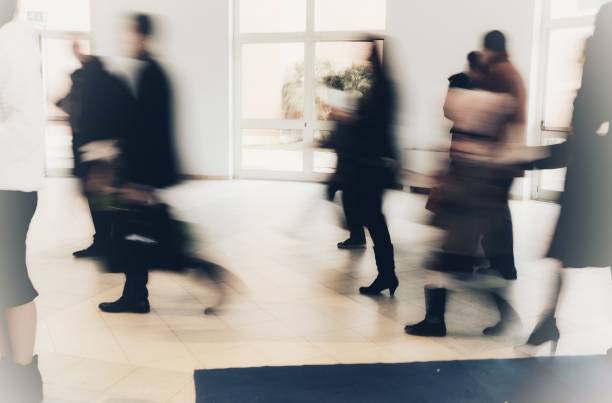 istock abstract crowd of anonymous blurred people walking in a shopping mall 929162586