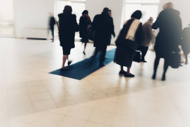istock abstract crowd of anonymous blurred people walking in a shopping mall 929162590
