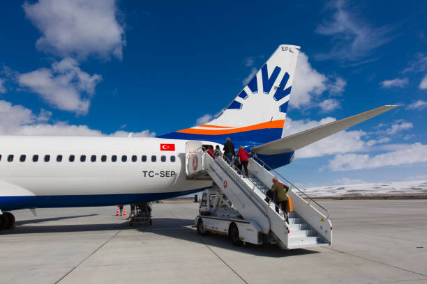 Airport Kars, Turkey - March 07, 2017: People are entering to Sunexpress flight to Izmir on March 07, 2017 in Kars airport - Turkey. sunexpress stock pictures, royalty-free photos & images