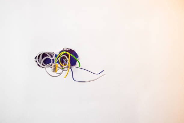 istock Unfinished electrical mains outlet socket with electrical wires and connector installed in plasterboard drywall for gypsum walls in apartment is under construction and remodeling. 929177882