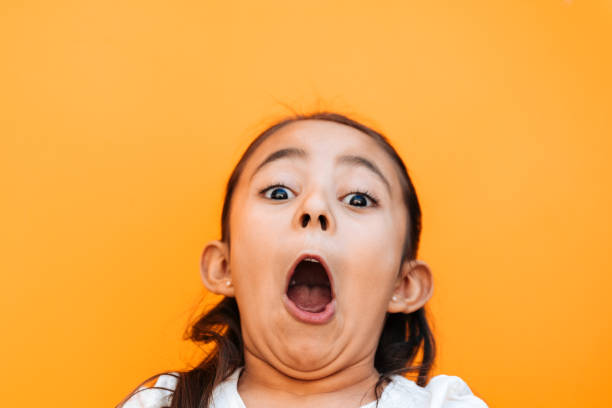 Little Girl Facial Expressions Portrait of a little girl in shock mouth open human face shouting screaming stock pictures, royalty-free photos & images