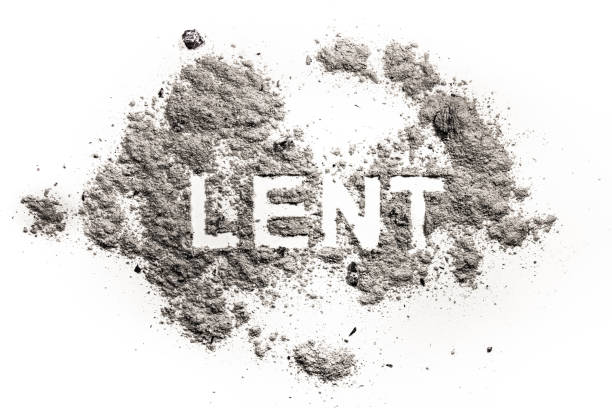 istock Lent word written in ash, sand or dust 929192110