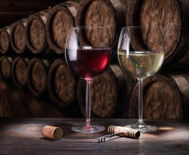 istock Wine glasses on the old wooden table. 929196758