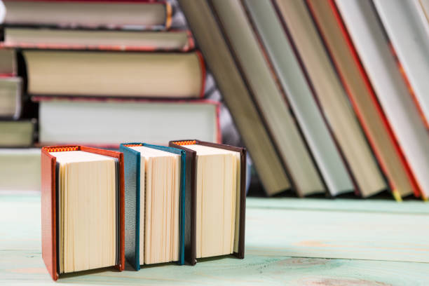 istock Pile of various books on wooden background 929200112