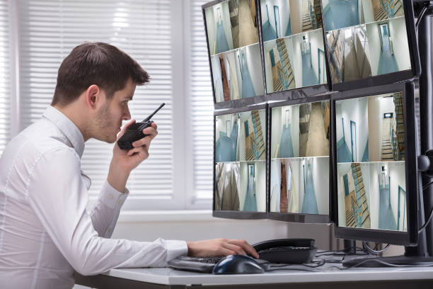 istock Security Guard Monitoring CCTV Footage 929210600