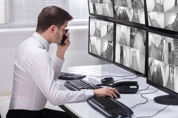 istock Security Guard Monitoring CCTV Footage 929210618