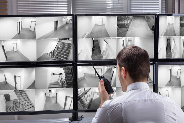 istock Security Guard Monitoring CCTV Footage 929210690
