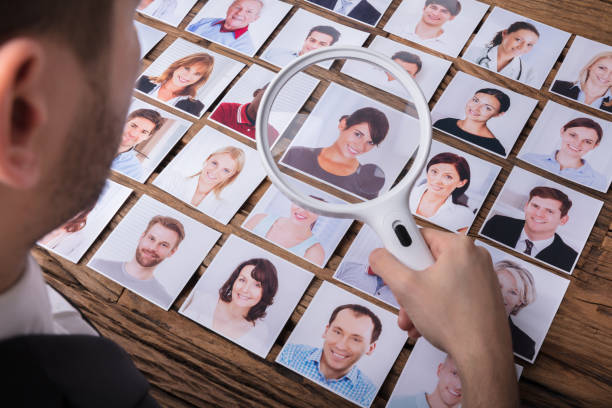 istock Looking At Candidate's Photograph With Magnifying Glass 929210916