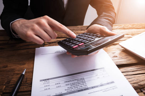 istock Businessperson Calculating Bill With Calculator 929211520