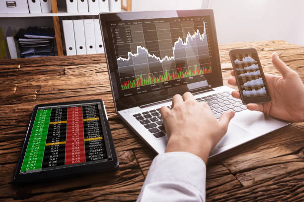 istock Stock Market Broker Working With Graphs On Laptop 929211628