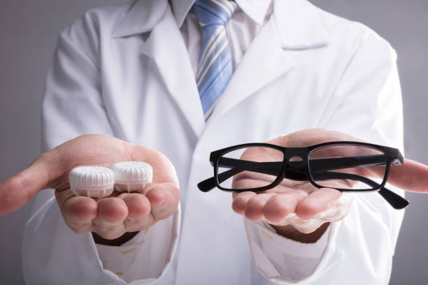 istock Doctor's Hand With Eyeglasses And Lens Case 929211720
