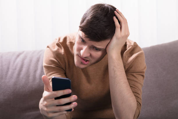 istock Shocked Man Looking At Smartphone 929212196
