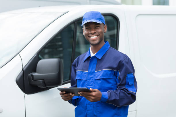 istock Young African Delivery Man Holding Digital Tablet 929212496