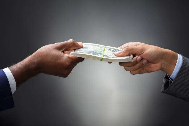 istock Person Giving Bundle Of Banknote 929215616