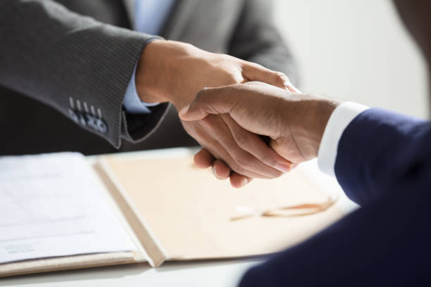 istock Close-up Of Businessperson Shaking Hand With Candidate 929215744