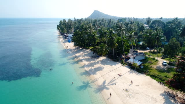 aerial drone flight over beautiful beach in thailand, koh samui