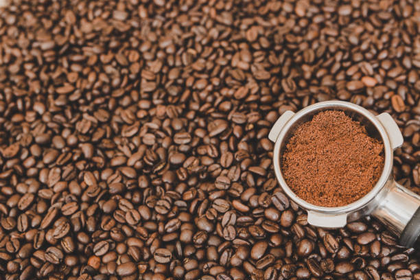 istock Espresso machine scoop on coffee beans background 929216756