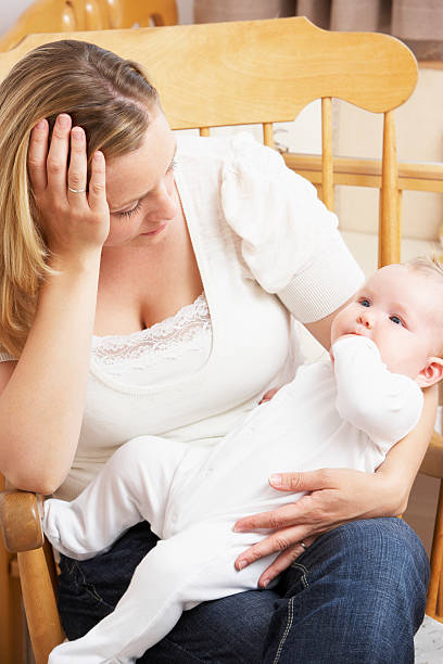 istock Worried Mother Holding Baby 92922063