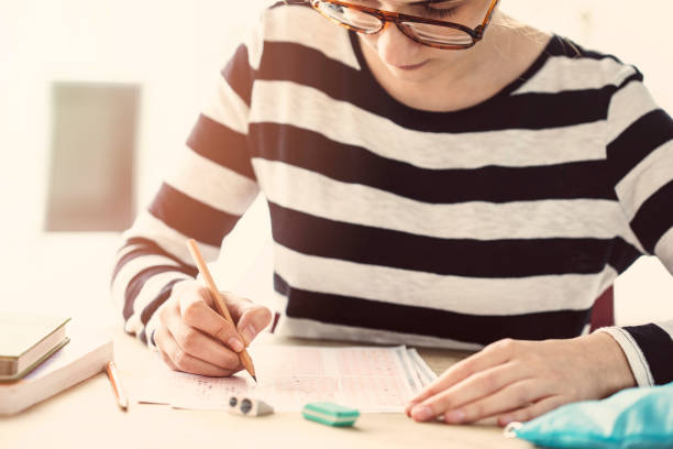 istock Young female student in examination 929222220