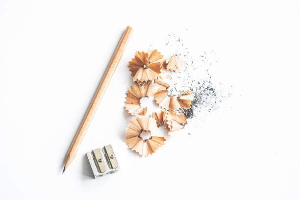 Pencil sharpener and pencil shavings on white background Pencil sharpener and pencil shavings on white background sharpening photos stock pictures, royalty-free photos & images
