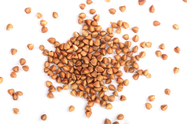 istock buckwheat grain isolated on white background close up. Top view 929226512