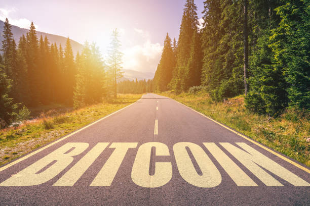 istock Bitcoin word written on road in the mountains 929231134
