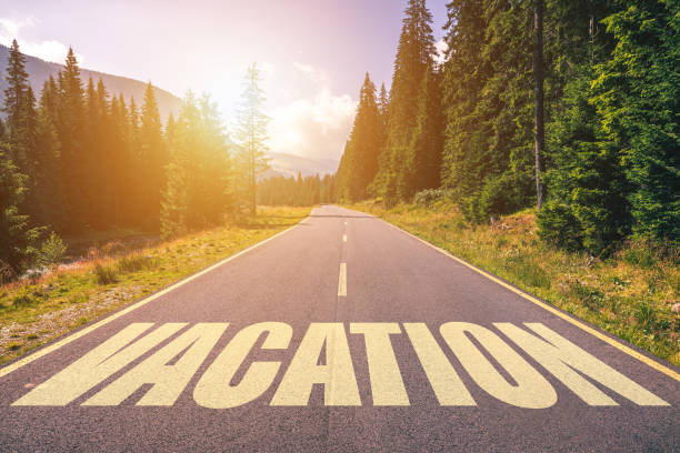 istock Vacation word written on road in the mountains 929231148