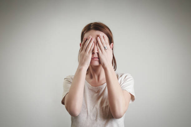 istock Woman hiding face with her hands 929239540