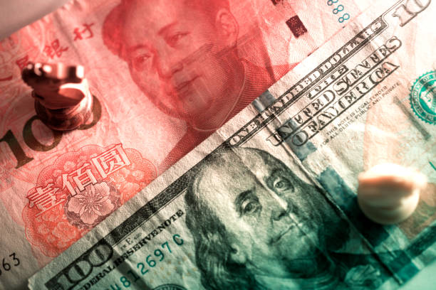 istock US dollar with Chinese yuan together and knight chess piece 929245570