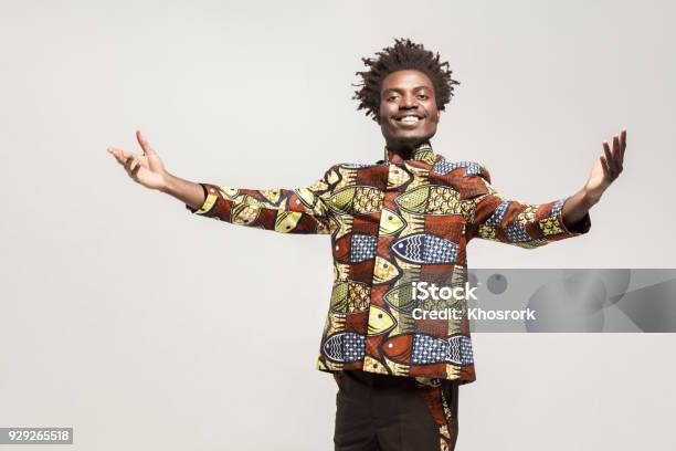 Friendly Afro Man In Traditional Clothes Toothy Smile Say Welcome Stock Photo - Download Image Now