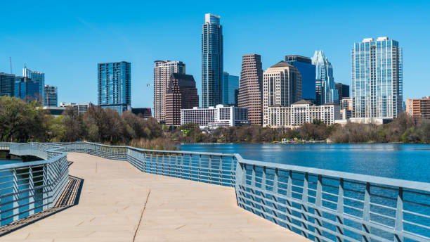 istock Sunny Day in Austin , Texas Urban Pedestrian Riverside Bridge View 929297438