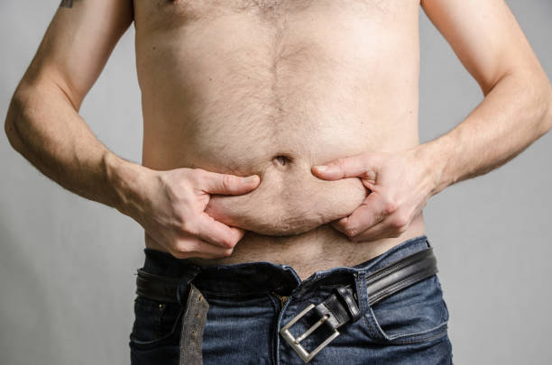 istock Close up on a man grabbing his fat belly 929300080