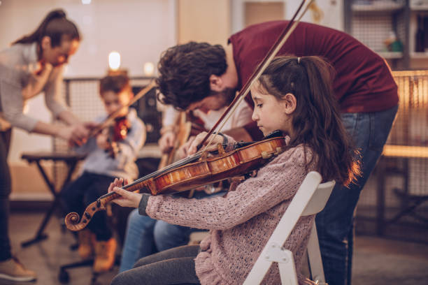 istock Children fun in music school 929300448