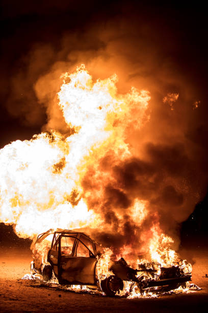istock Ruined Car Burning at Night 929301064