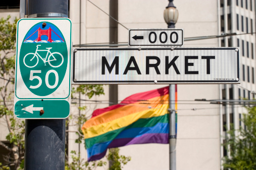 Sign for Market street and Gay pride flag
